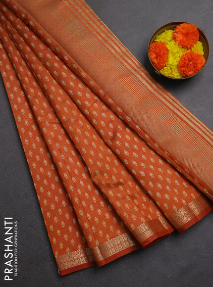 Semi raw silk saree rustic orange with allover butta prints and zari woven border