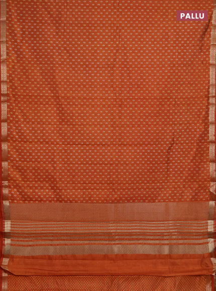 Semi raw silk saree rustic orange with allover butta prints and zari woven border