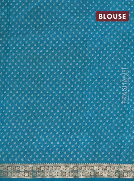 Semi raw silk saree teal green with allover butta prints and zari woven border