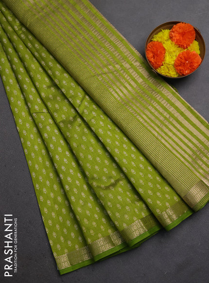 Semi raw silk saree light green with allover butta prints and zari woven border