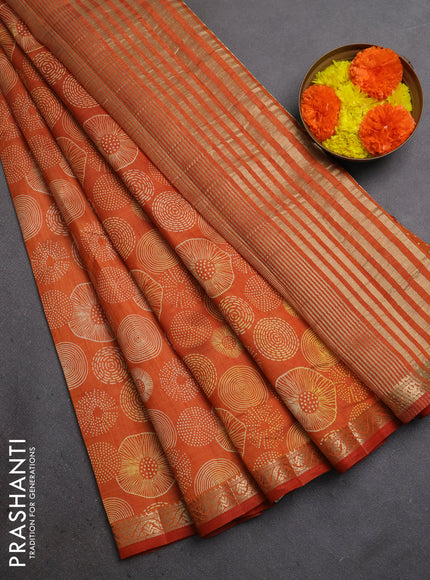 Semi raw silk saree rustic orange with allover geometric prints and small zari woven border