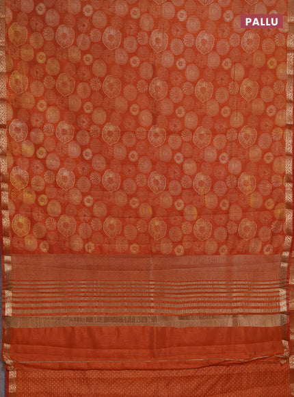 Semi raw silk saree rustic orange with allover geometric prints and small zari woven border