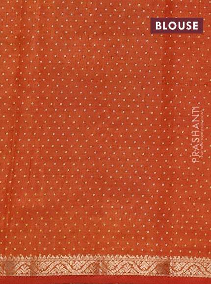 Semi raw silk saree rustic orange with allover geometric prints and small zari woven border