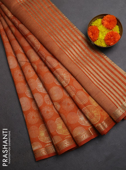 Semi raw silk saree rust shade with allover geometric prints and small zari woven border
