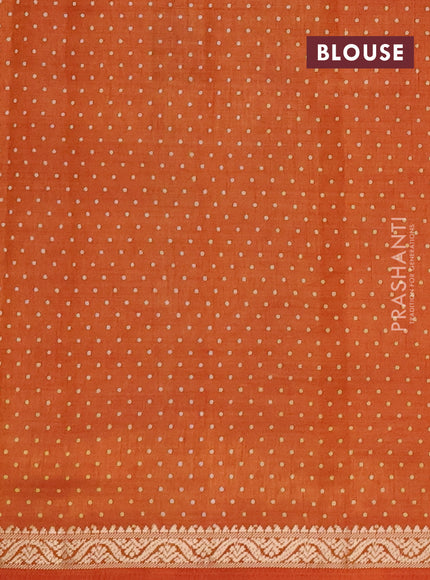 Semi raw silk saree rust shade with allover geometric prints and small zari woven border