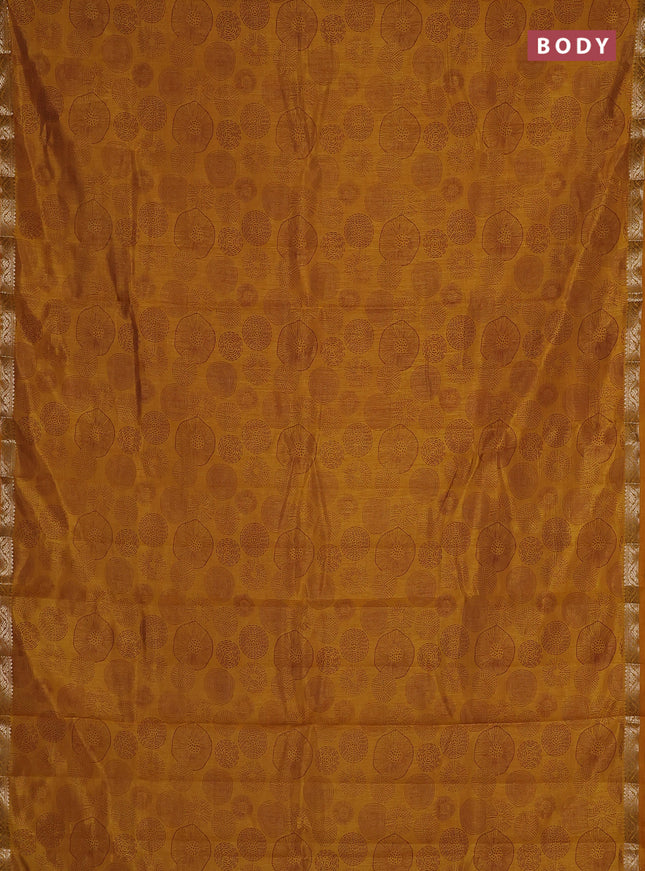 Semi raw silk saree dark mustard with allover geometric prints and small zari woven border