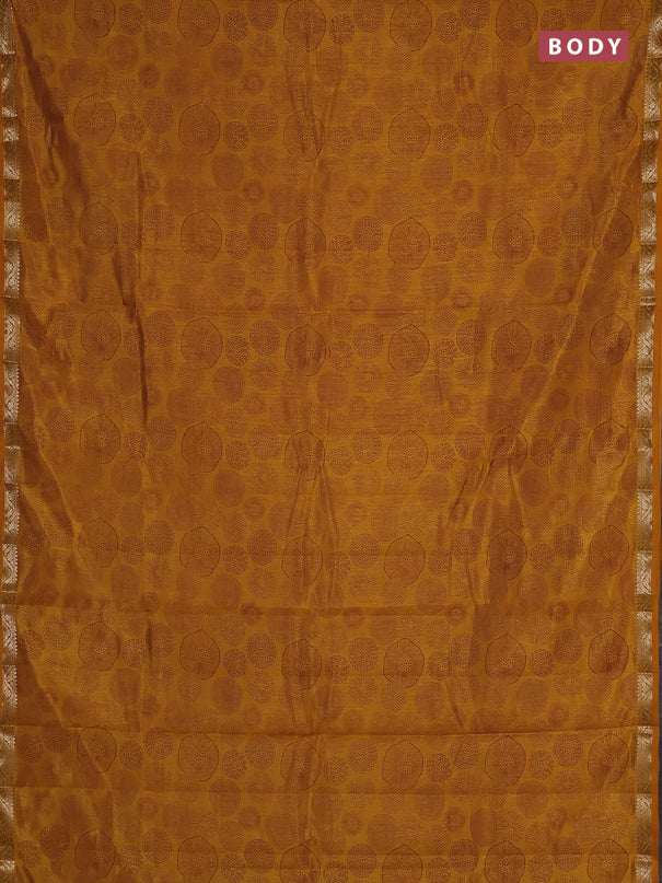Semi raw silk saree dark mustard with allover geometric prints and small zari woven border