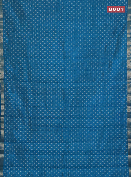 Semi raw silk saree teal blue with allover butta prints and zari woven border