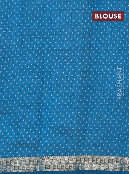 Semi raw silk saree teal blue with allover butta prints and zari woven border