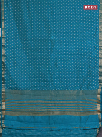 Semi raw silk saree teal green with allover butta prints and zari woven border