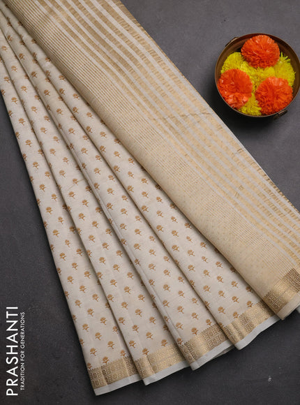 Semi raw silk saree cream with allover butta prints and zari woven border