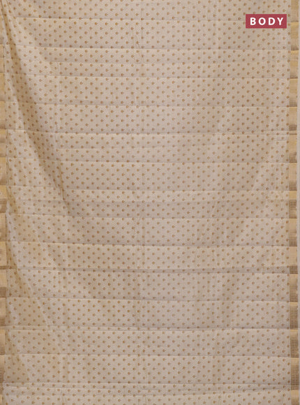 Semi raw silk saree cream with allover butta prints and zari woven border