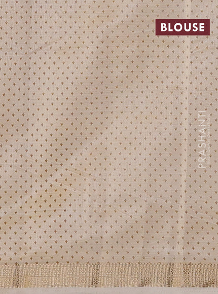Semi raw silk saree cream with allover butta prints and zari woven border