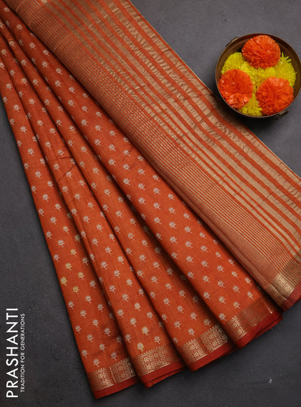 Semi raw silk saree rustic orange with allover butta prints and zari woven border
