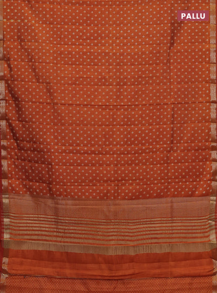 Semi raw silk saree rustic orange with allover butta prints and zari woven border