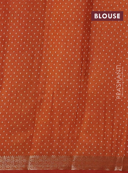 Semi raw silk saree rustic orange with allover butta prints and zari woven border