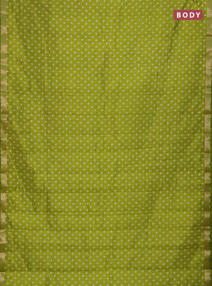 Semi raw silk saree light green with allover butta prints and zari woven border