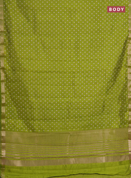 Semi raw silk saree light green with allover butta prints and zari woven border