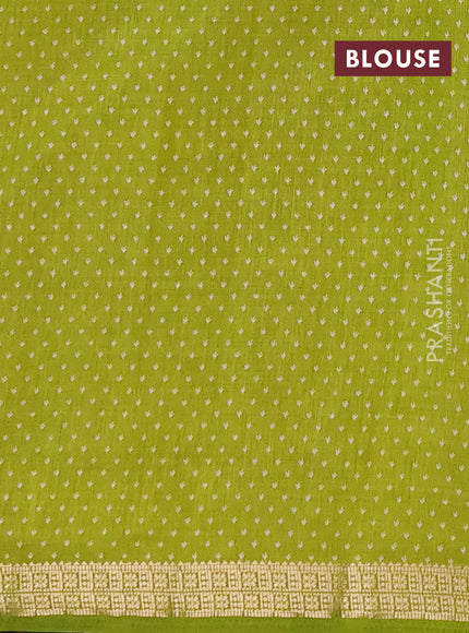 Semi raw silk saree light green with allover butta prints and zari woven border