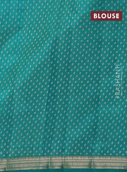 Semi raw silk saree teal green with allover geometric prints and zari woven border