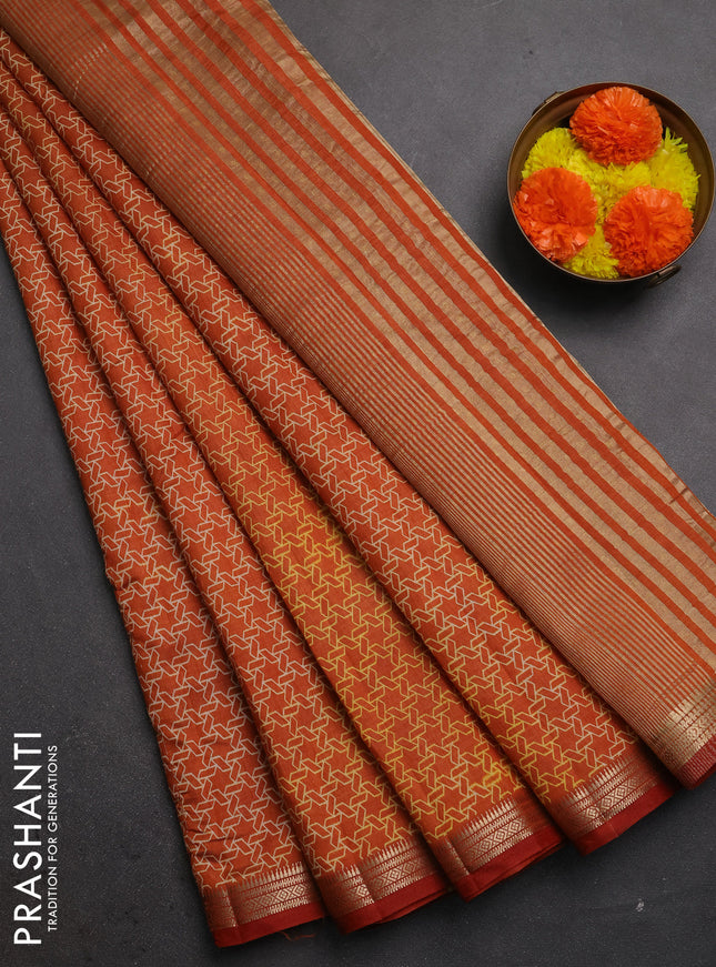 Semi raw silk saree rustic orange with allover geometric prints and zari woven border
