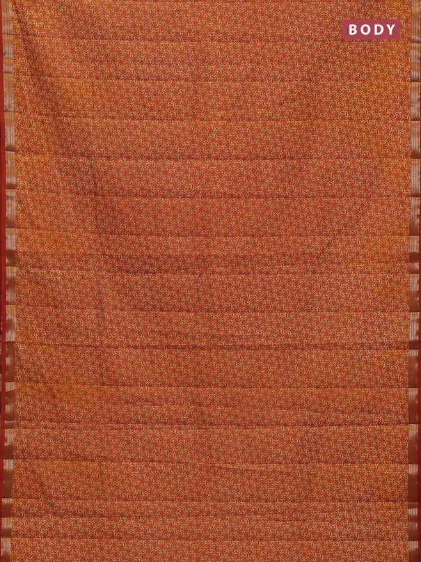 Semi raw silk saree rustic orange with allover geometric prints and zari woven border