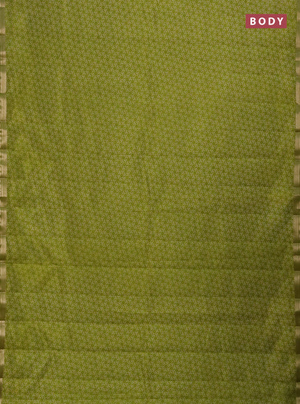 Semi raw silk saree light green with allover geometric prints and zari woven border