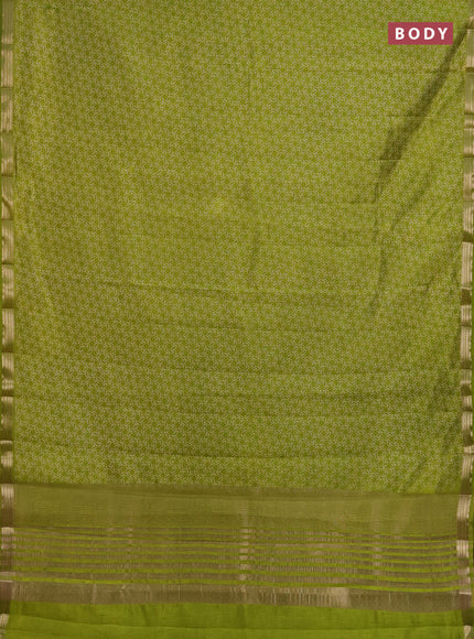 Semi raw silk saree light green with allover geometric prints and zari woven border