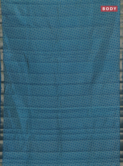 Semi raw silk saree peacock blue with allover geometric prints and zari woven border