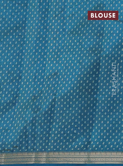 Semi raw silk saree peacock blue with allover geometric prints and zari woven border