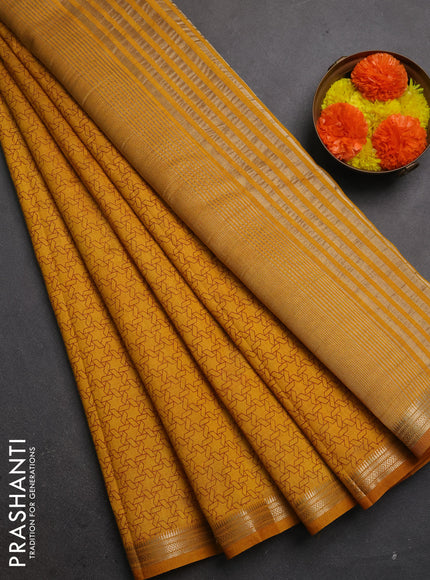 Semi raw silk saree dark mustard with allover geometric prints and zari woven border