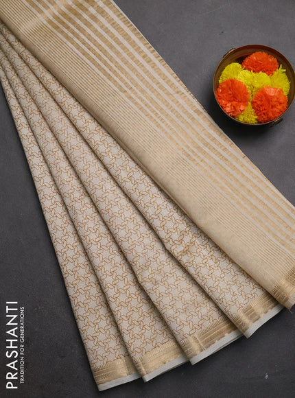 Semi raw silk saree cream with allover geometric prints and zari woven border