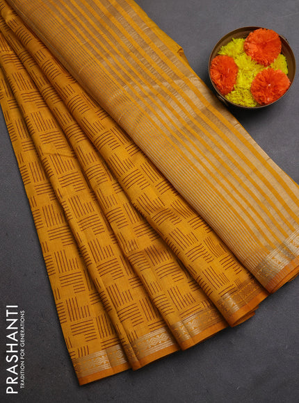 Semi raw silk saree dark mustard with allover geometric prints and zari woven border