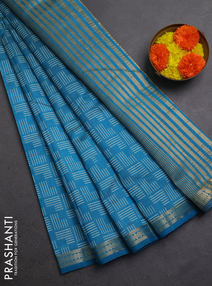 Semi raw silk saree teal blue with allover geometric prints and zari woven border