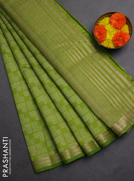 Semi raw silk saree light green with allover geometric prints and zari woven border