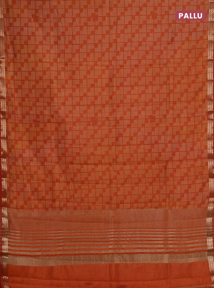 Semi raw silk saree rustic orange with allover geometric prints and zari woven border