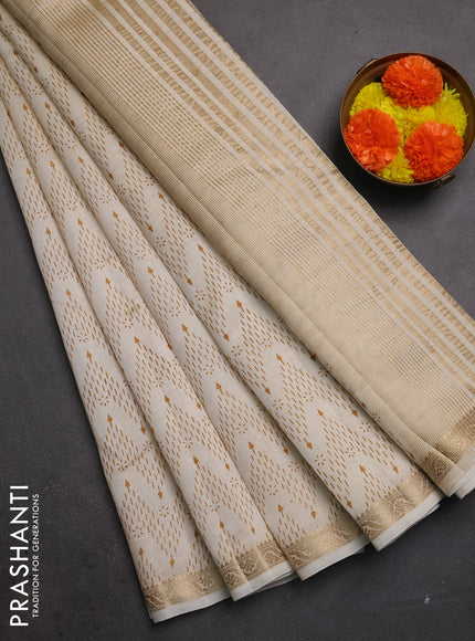 Semi raw silk saree cream with allover prints and zari woven border