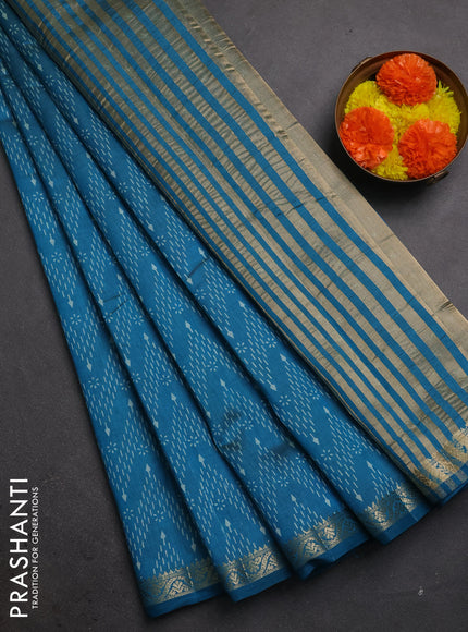 Semi raw silk saree teal blue with allover prints and zari woven border