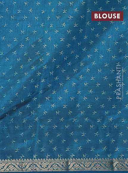 Semi raw silk saree teal blue with allover prints and zari woven border