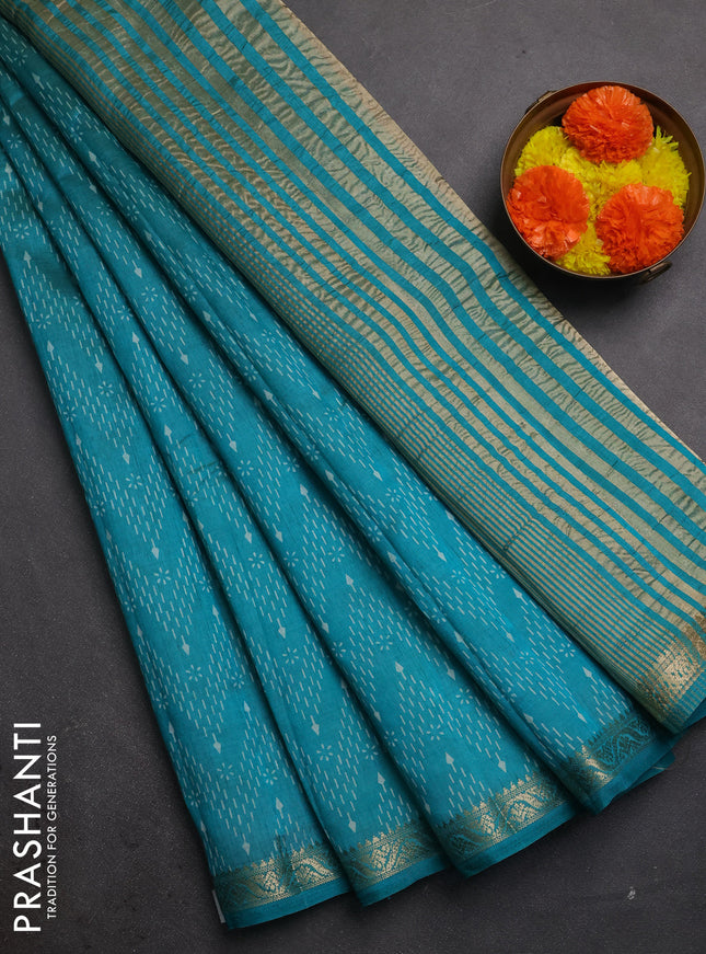 Semi raw silk saree teal green with allover prints and zari woven border