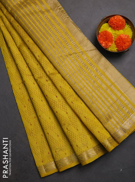 Semi raw silk saree mustard yellow with allover prints and zari woven border