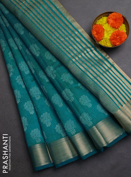 Semi raw silk saree teal blue with allover floral butta prints and zari woven border