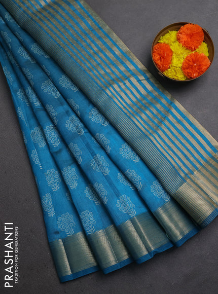 Semi raw silk saree peacock blue with allover floral butta prints and zari woven border