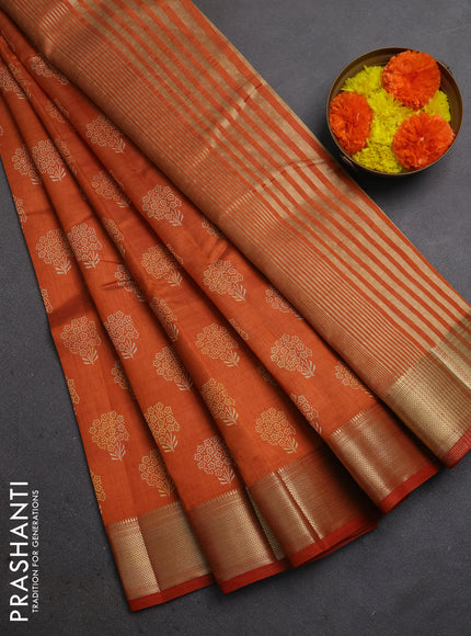 Semi raw silk saree rustic orange with allover floral butta prints and zari woven border