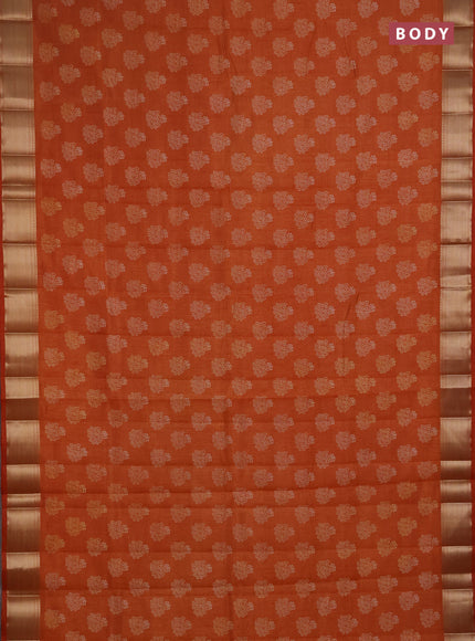 Semi raw silk saree rustic orange with allover floral butta prints and zari woven border