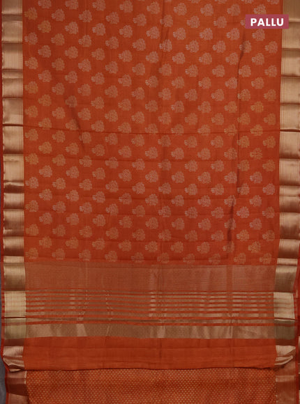 Semi raw silk saree rustic orange with allover floral butta prints and zari woven border