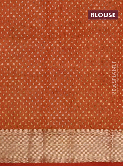 Semi raw silk saree rustic orange with allover floral butta prints and zari woven border