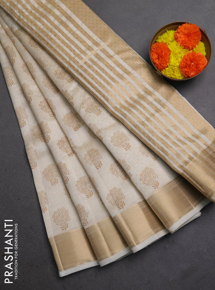 Semi raw silk saree cream with allover floral butta prints and zari woven border