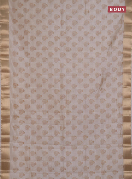 Semi raw silk saree cream with allover floral butta prints and zari woven border