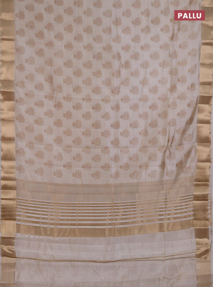 Semi raw silk saree cream with allover floral butta prints and zari woven border